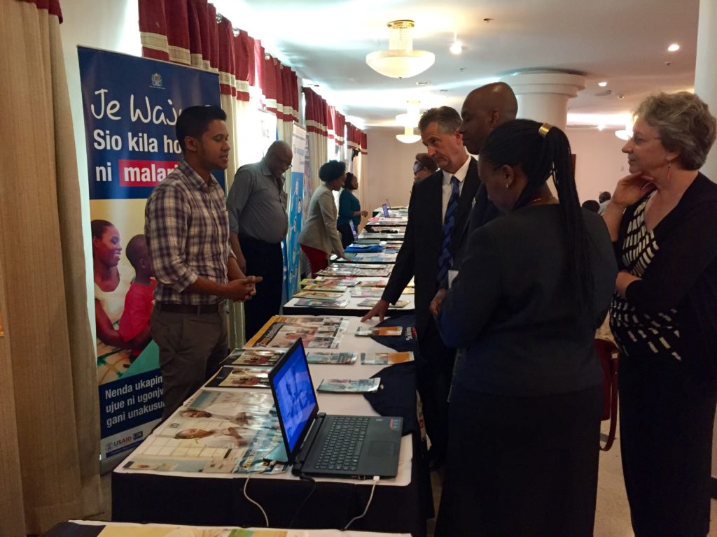 VIPs visit TCCP booths at the Tanzania Capacity and Communication Project (TCCP) end of project event.