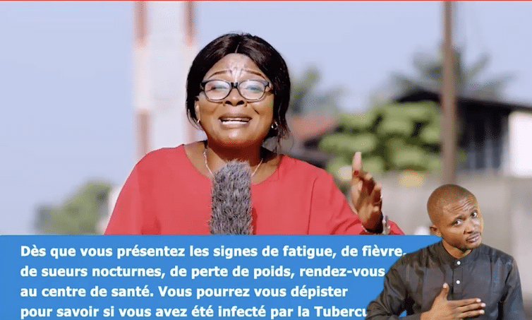 still shot of female tv host in DRC during a quiz show with a signer in the lower right hand corner